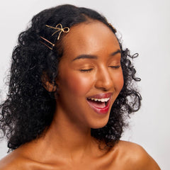 Kitsch petite gold bow barrette detail adding elegant accent