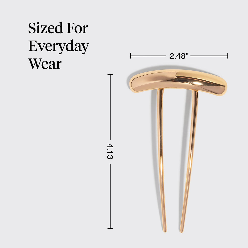 Kitsch hair pin holding a bun to show reliable hold and neat styling benefit