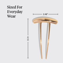 Kitsch hair pin holding a bun to show reliable hold and neat styling benefit