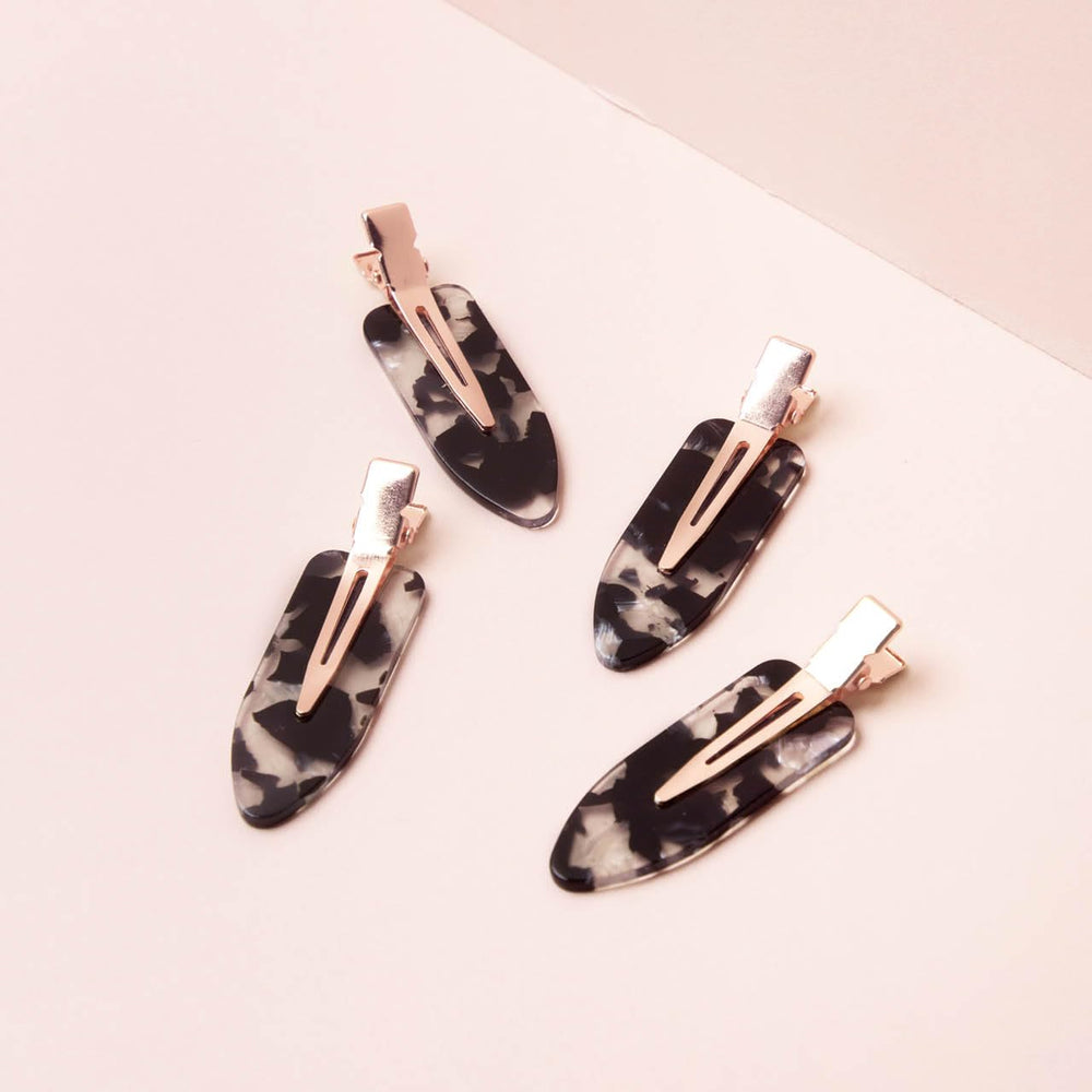 Kitsch clips on bathroom vanity keeping hair away during skincare