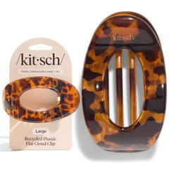 kitsch lifestyle beach setting securing hair during sunny outdoor activities