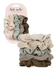 Kitsch scrunchies flat-lay with outfit pieces to show styling versatility