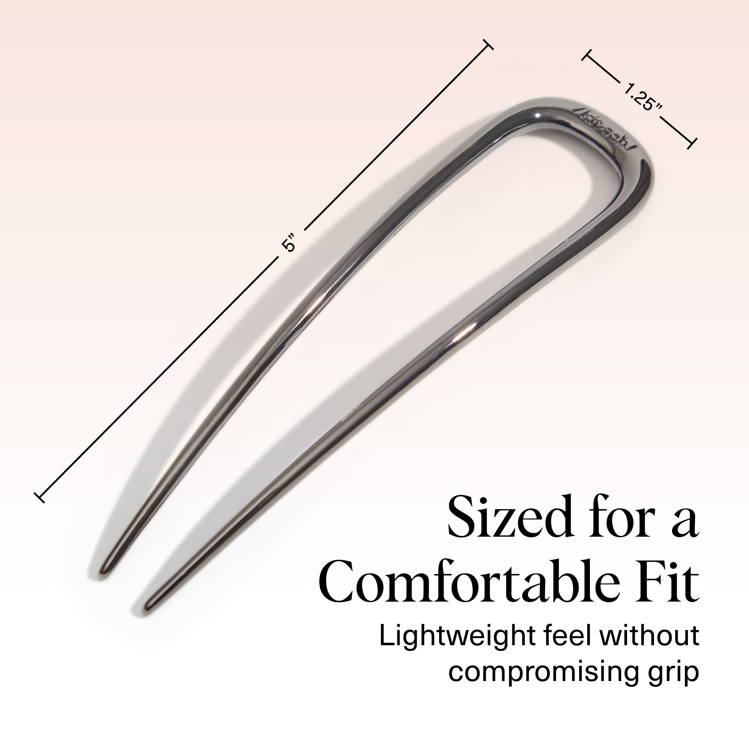 Kitsch pin inserted in a French twist to demonstrate firm anchoring benefit