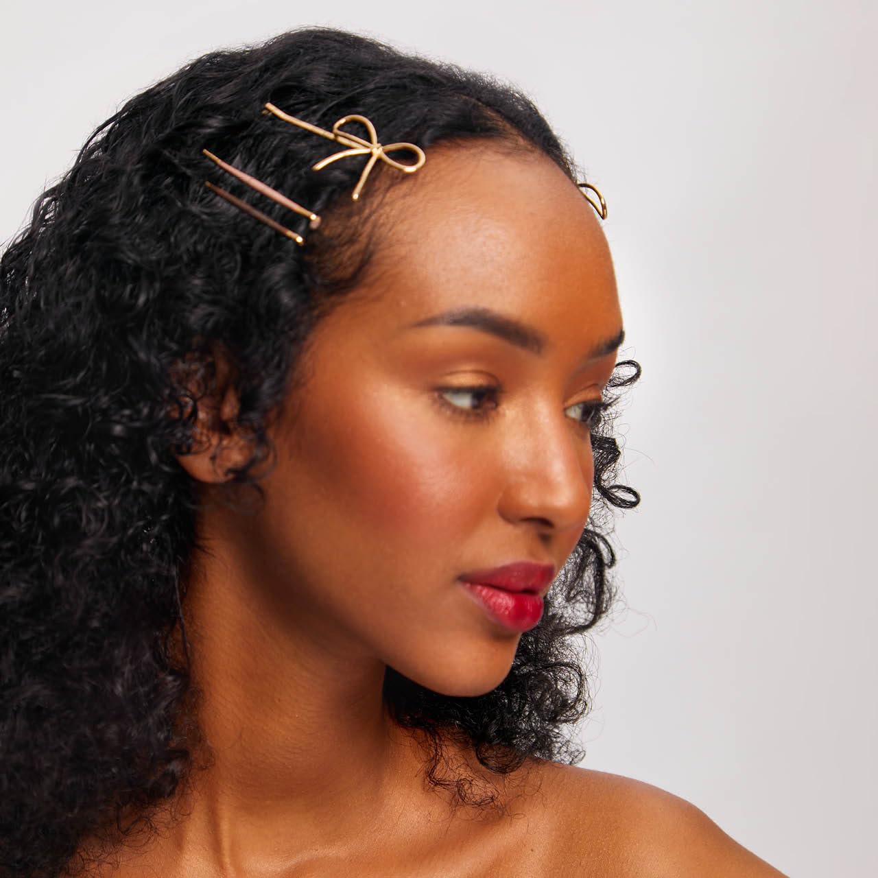 Kitsch pins clipped into a ballet hair net for tidy styling
