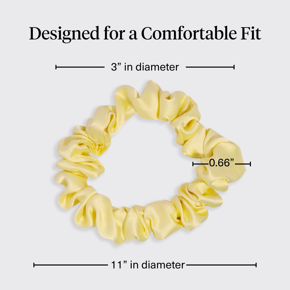 Kitsch scrunchie on pillow illustrating overnight wear to reduce morning frizz benefit