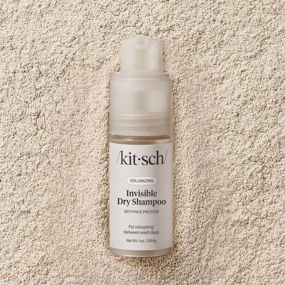 Kitsch 1oz bottle beside a coin showing compact travel-friendly size