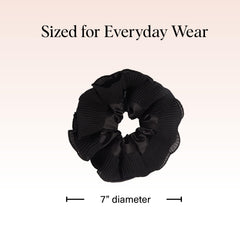 Kitsch scrunchie worn on wrist as accessory offering convenient styling and on-the-go benefit