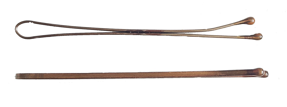Kleravitex pins beside a ruler showing 2.75 inch length for thicker hair