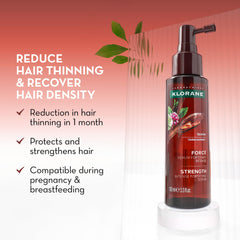 Klorane dropper applying serum to scalp for targeted thinning support