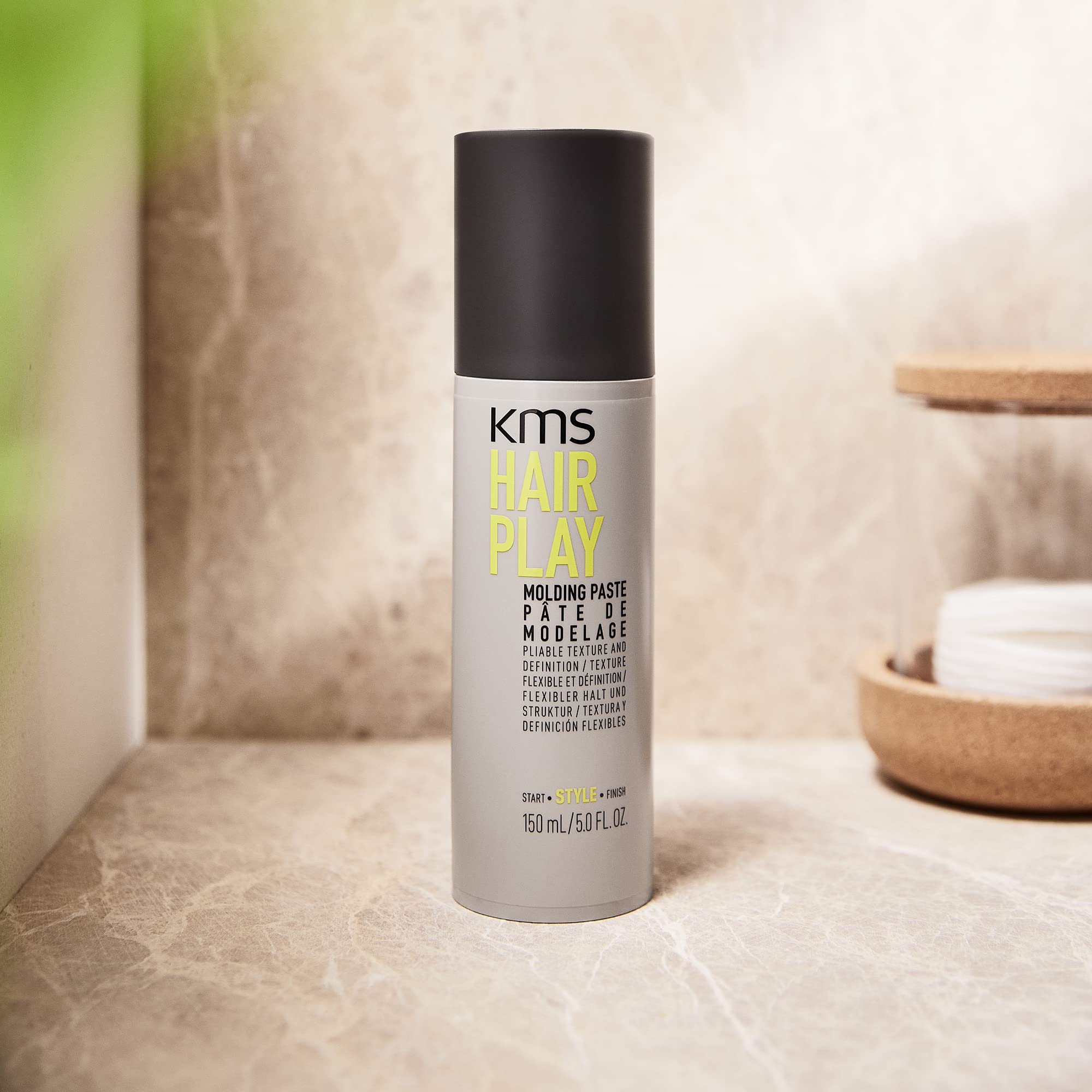 KMS 5 ounce jar next to measuring tape to show true size and portability