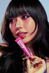 KNEMO lifestyle shot model smiling with glossy lips for confidence benefit