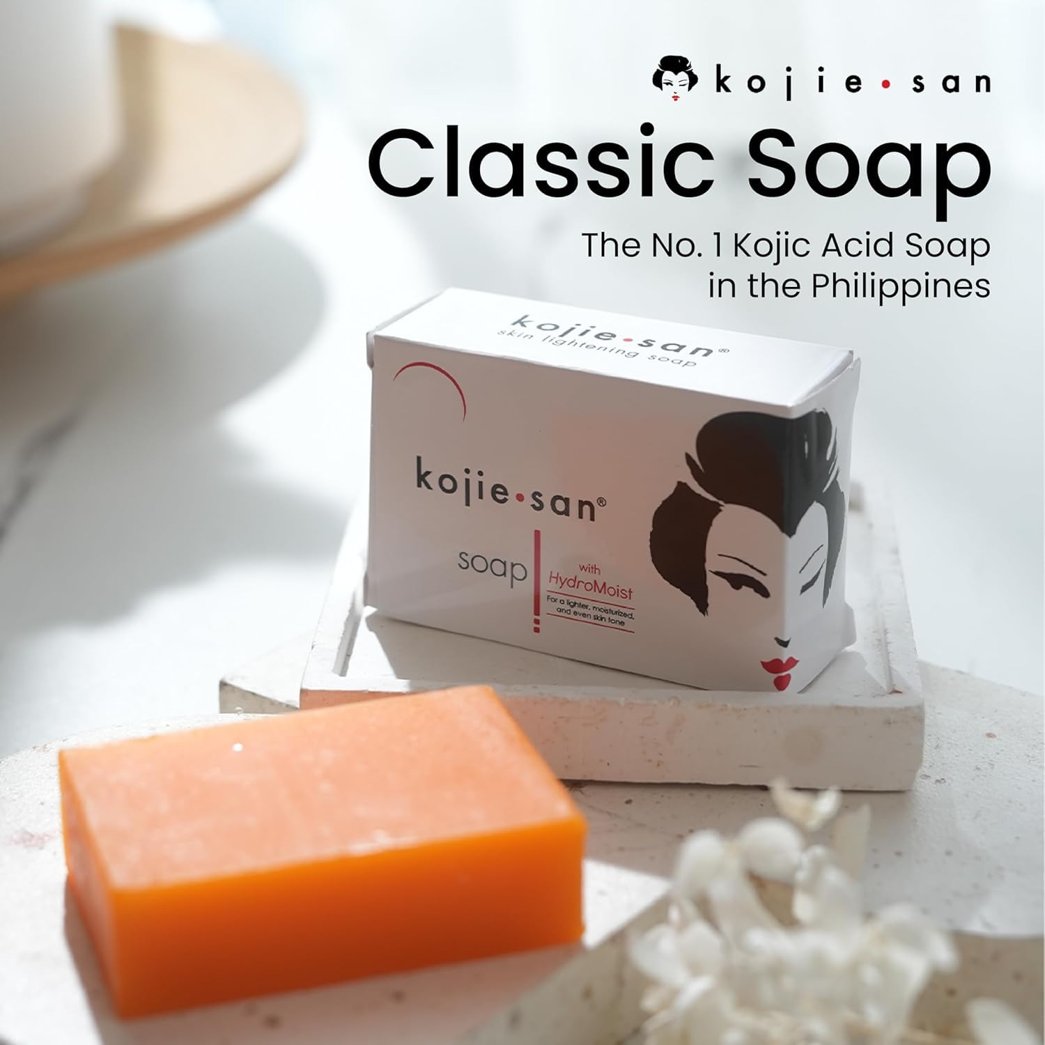 Kojie San bar resting in a soap dish to demonstrate dry storage prolongs bar life