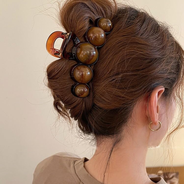 KOLONAMS hair clip worn in an updo demonstrating strong hold and polished look