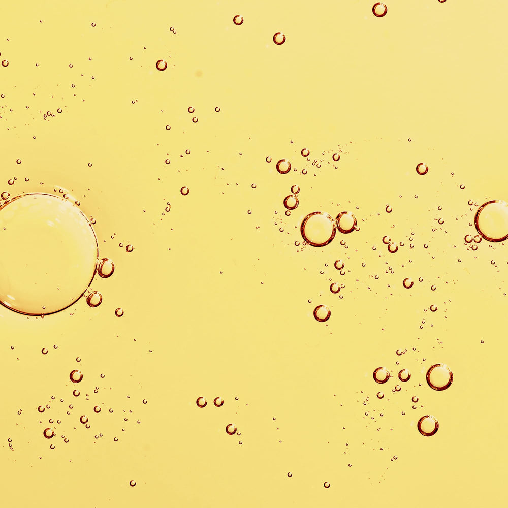 KORA Organics dropper dispensing oil highlighting precision and easy application