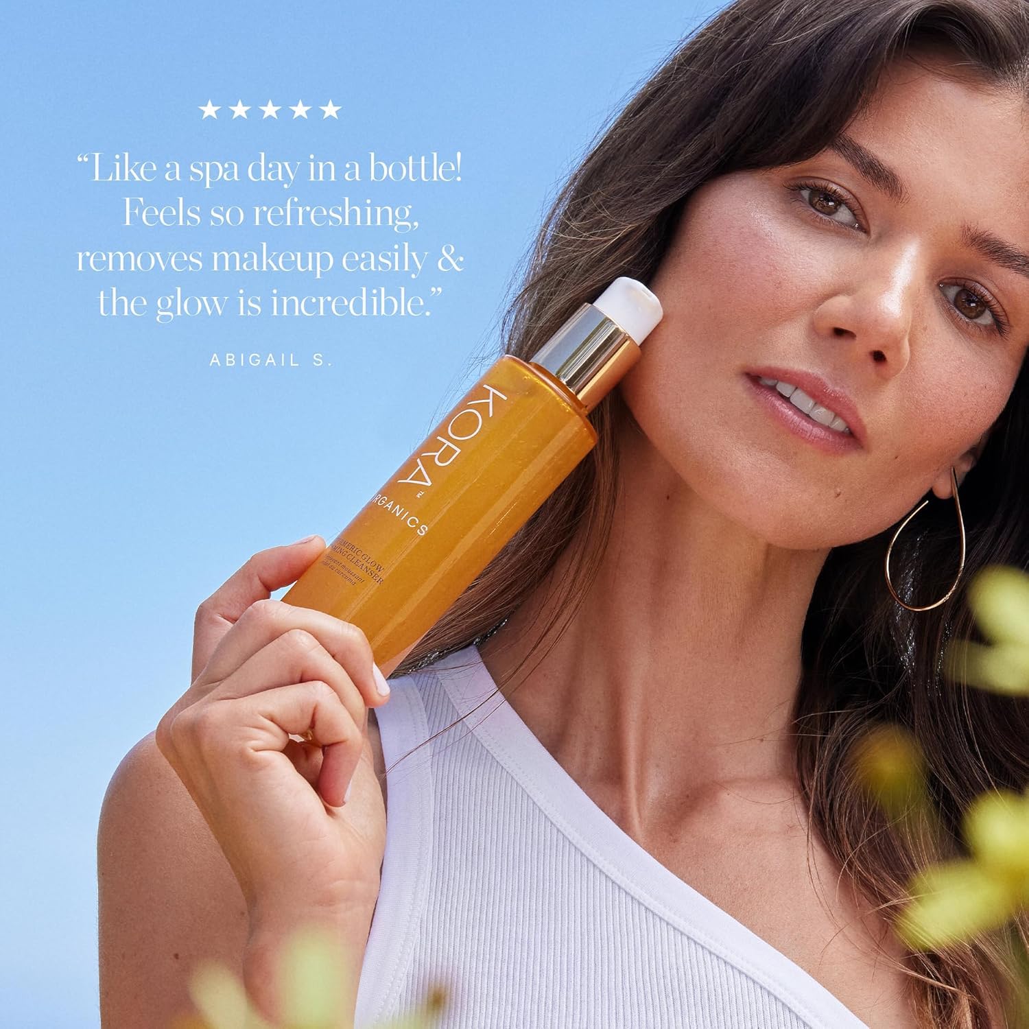KORA Organics next to hand for scale showing travel-friendly size convenience benefit