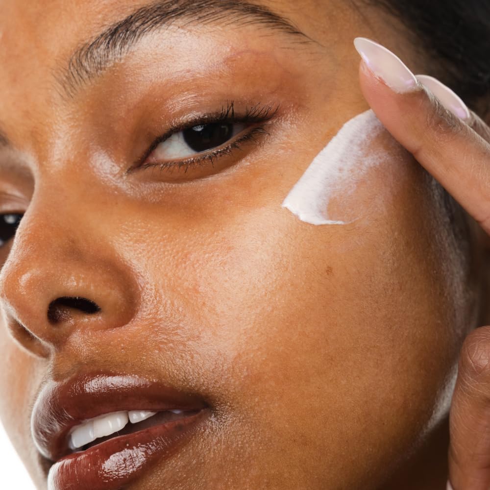 KORRES applying mineral milk on skin for lightweight protection