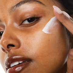 KORRES applying mineral milk on skin for lightweight protection