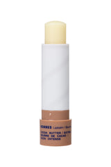 KORRES lip butter held in hand to show scale and easy on-the-go moisturizing benefit