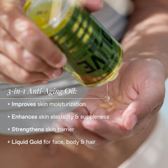 KORRES olive oil pouring from dropper highlighting pure cold-pressed texture benefit