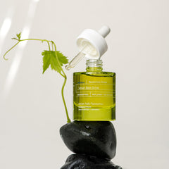 KORRES serum styled on bathroom shelf conveying everyday routine use