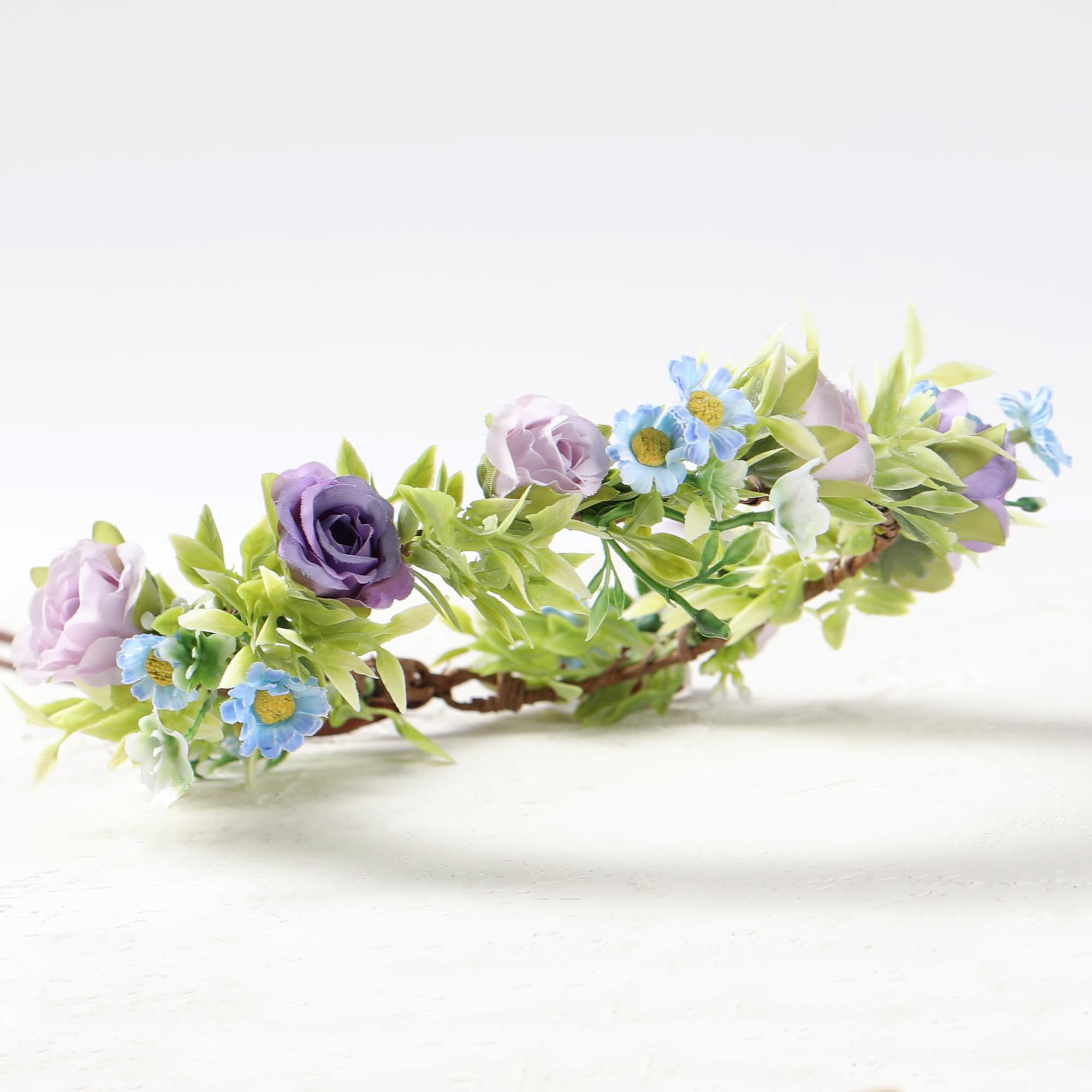 KorViSHOW crown beside ruler showing scale and lightweight wearable size benefit