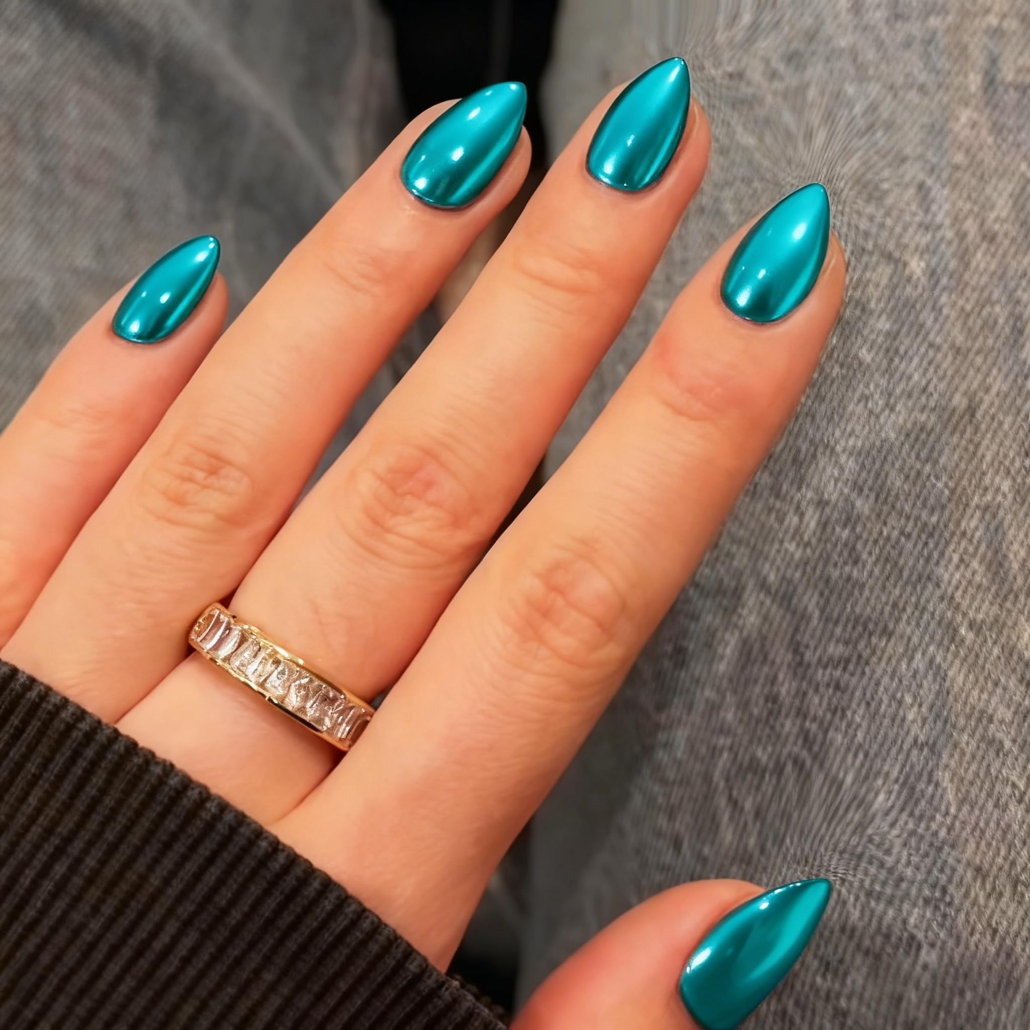 KQueenest close-up of mirror chrome texture highlighting reflective teal-green finish
