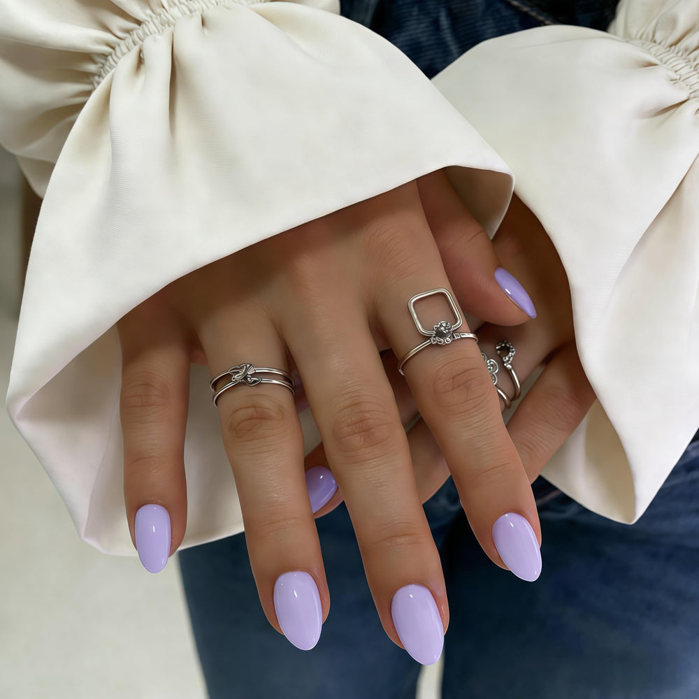 KQueenest close-up of glossy lilac oval nails highlighting smooth finish