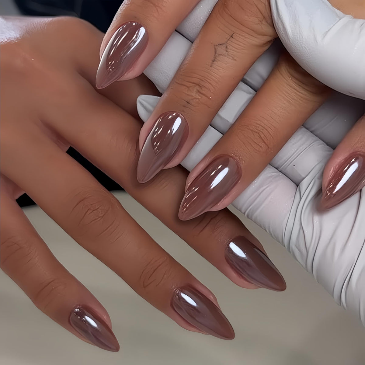 KQueenest front packaging showing brown almond chrome nails and benefits