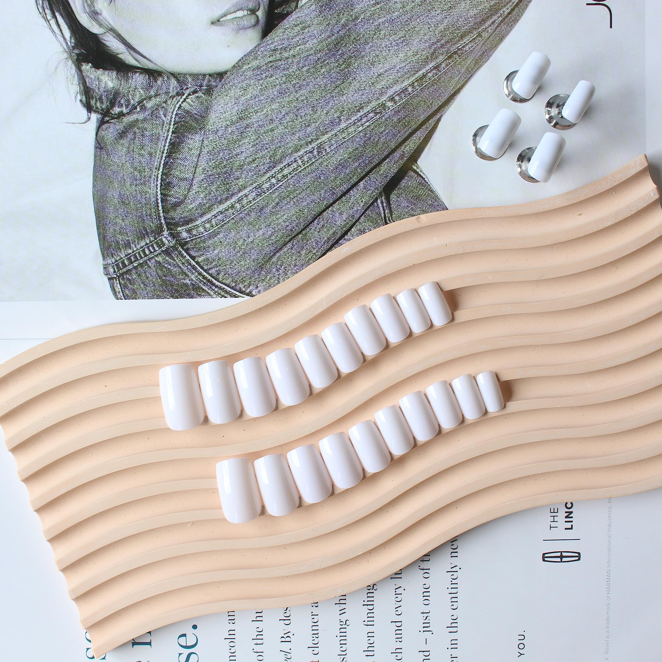 KQueenest nails in hand demonstrating scale and comfortable short length