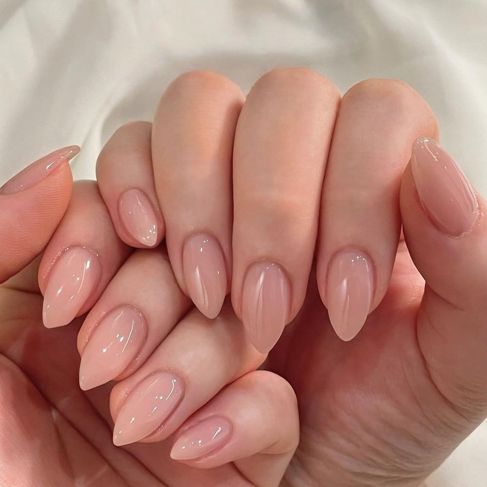 KQueenest nails held in hand illustrating size and comfortable short almond benefit