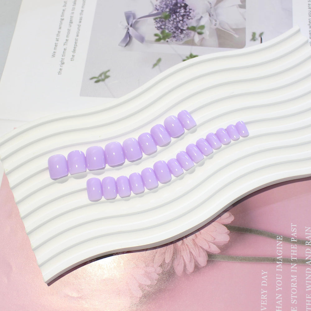KQueenest nails applied on hand demonstrating comfortable everyday wear and typing