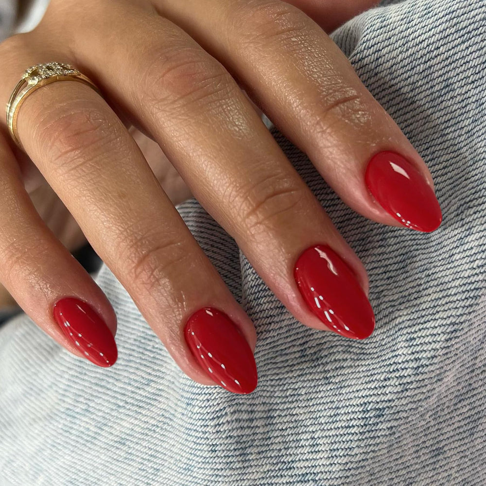 KQueenest front packaging showing 24-piece red press-on nails, ready for quick application
