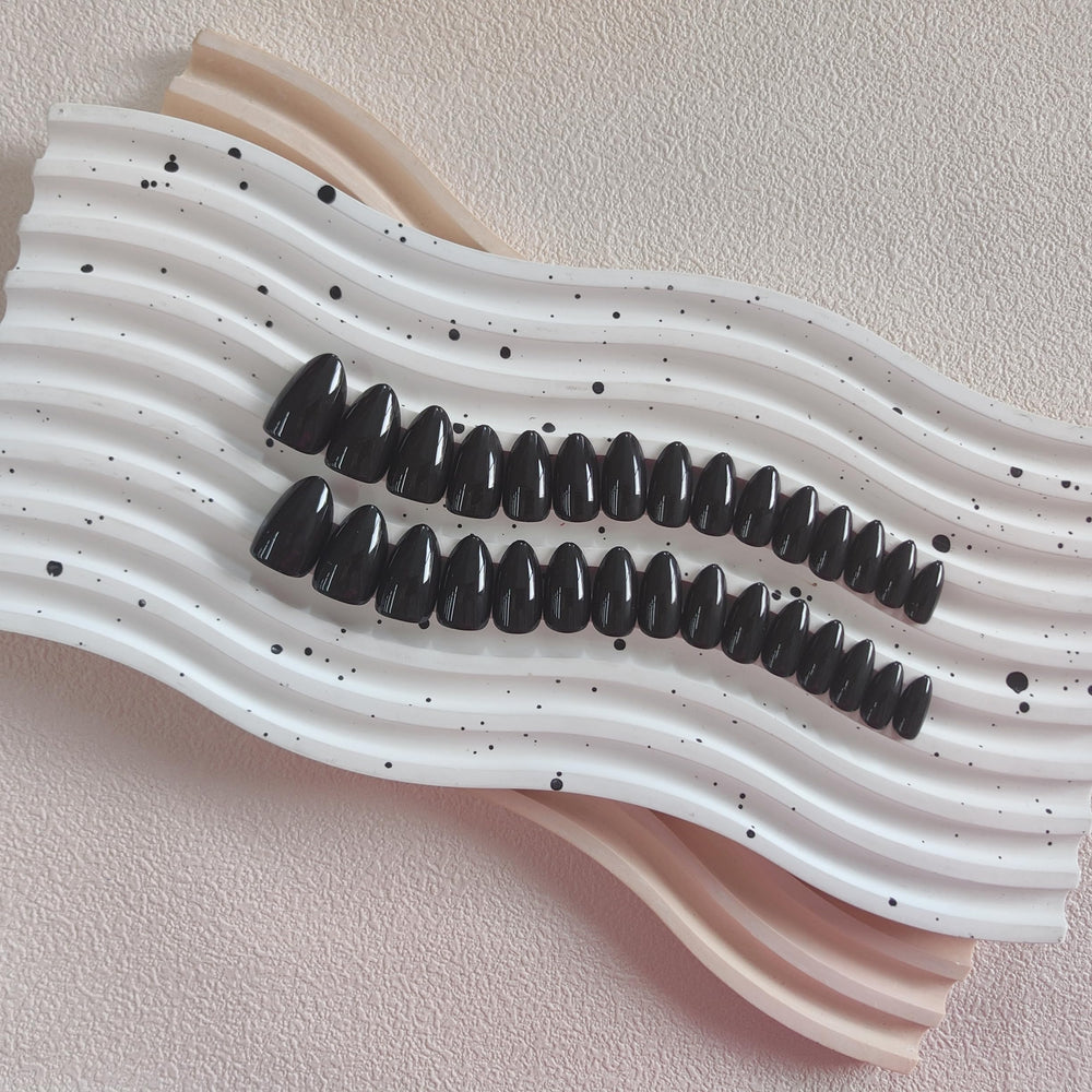 KQueenest side profile showing almond curve for natural fingertip fit and comfort