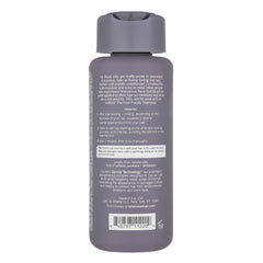 Kristin Ess conditioner creamy purple texture pouring, shows easy application