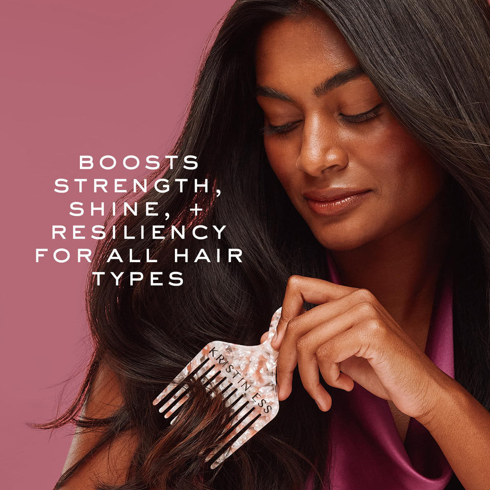 Kristin Ess label close-up highlighting biotin and amino acids