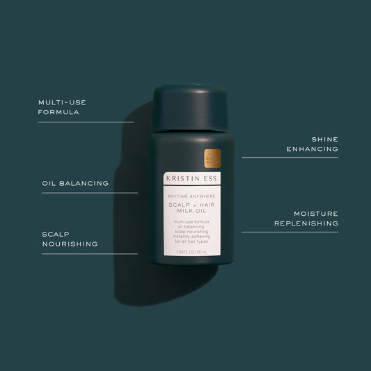 Kristin Ess dropper closeup dispensing oil for precise scalp application