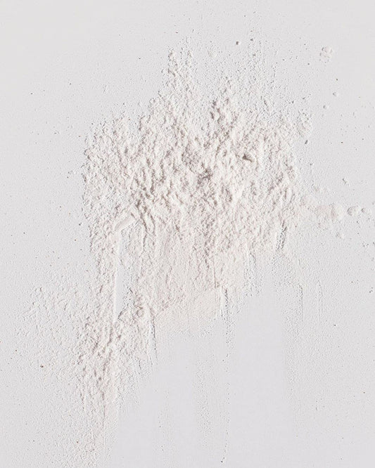 Kristin Ess open jar close-up of powder texture for easy blending