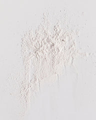 Kristin Ess open jar close-up of powder texture for easy blending