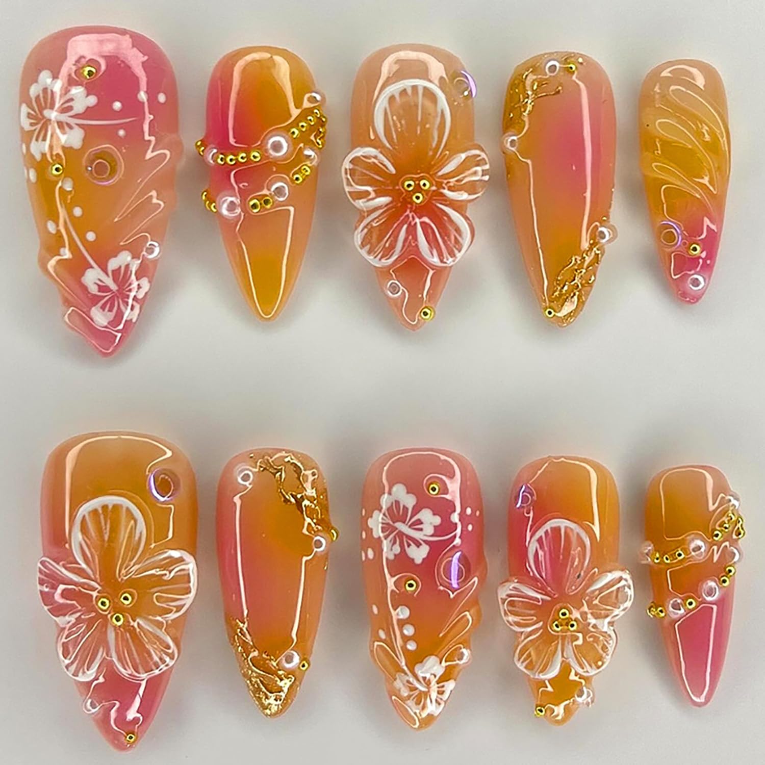 KRTBKR front view showing orange 3D floral press-on nails, quick glam