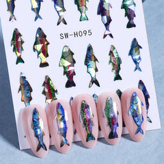 KSTBJN finished beach-themed manicure with fish decals offering summer sparkle