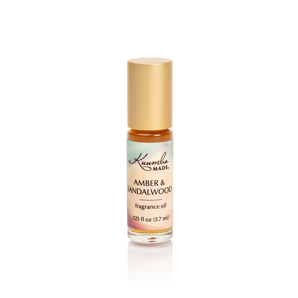Kuumba Made front bottle view showing amber sandalwood label and elegant packaging benefit: easy identification