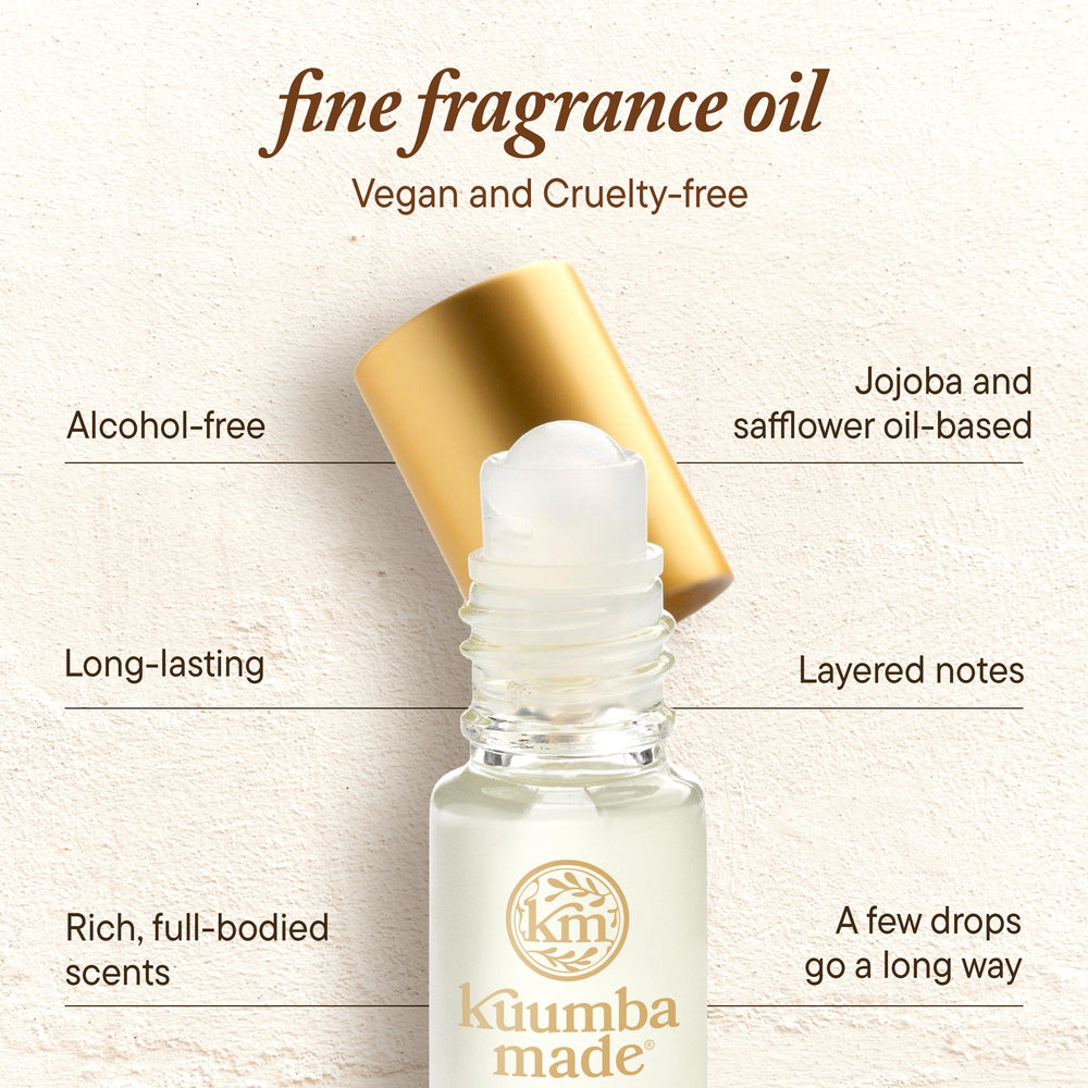 Kuumba Made bottle held by hand to show size and portable convenience