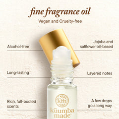 Kuumba Made bottle held by hand to show size and portable convenience