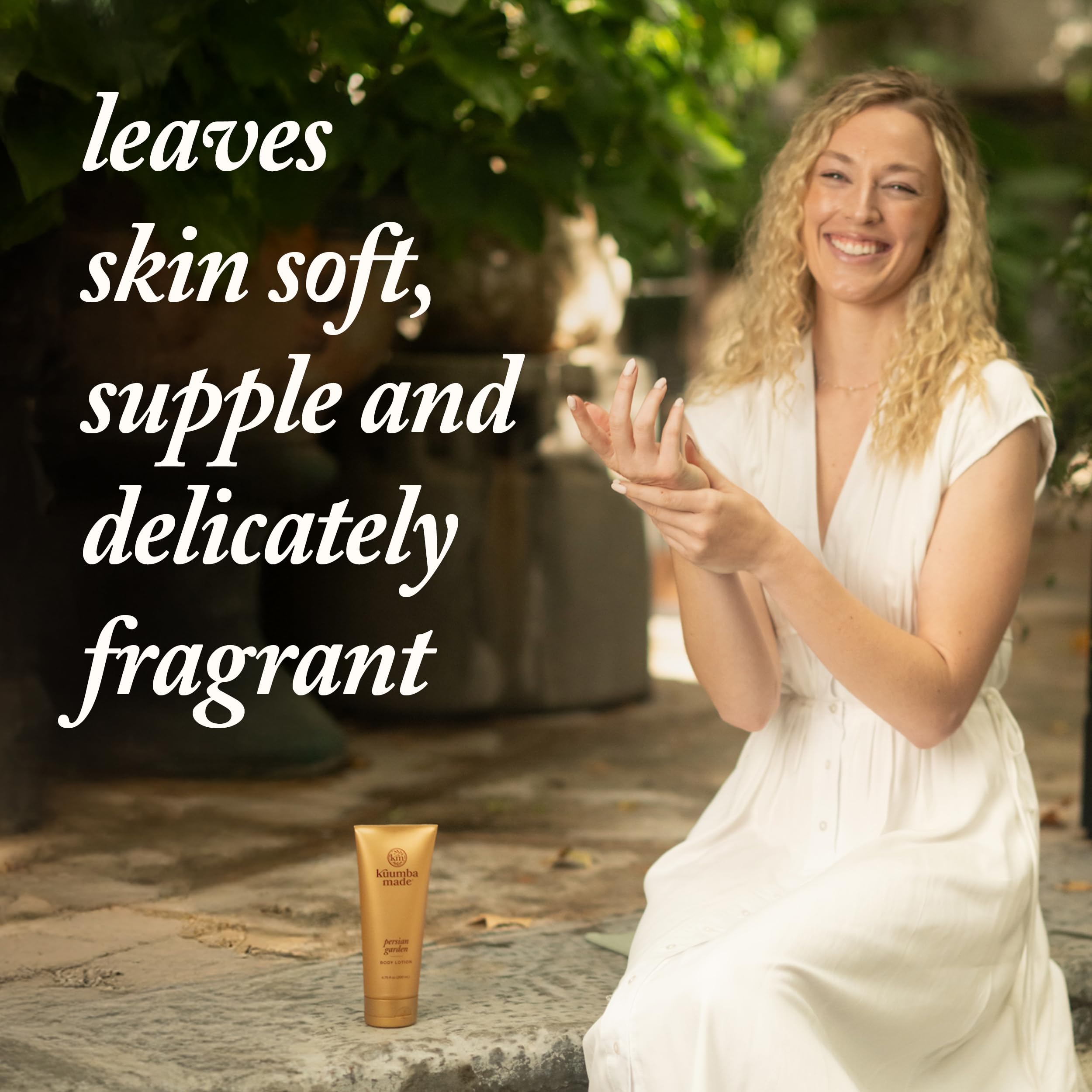 Kuumba Made hand applying lotion on arm illustrating smooth application and soft skin