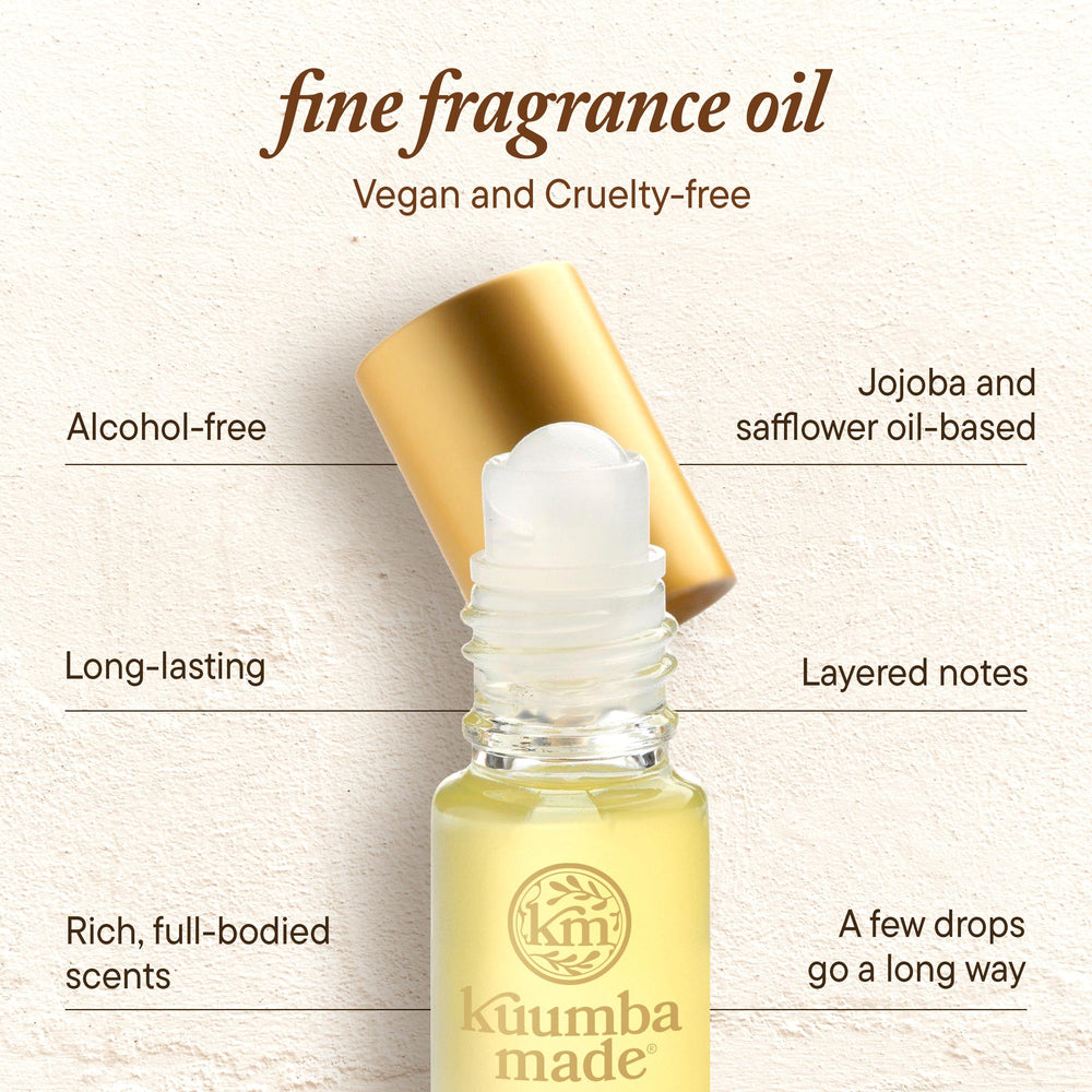 Kuumba Made applying roll-on to wrist demonstrating discreet, precise fragrance placement