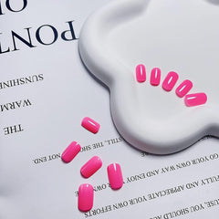 KXAMELIE nails applied with adhesive tabs for fast, tool-free attachment