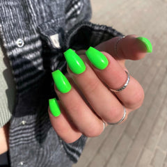 KXAMELIE close-up glossy surface showing neon green shine and salon-style finish