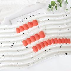 KXAMELIE nails in hand demonstrating natural short square fit and comfortable daily wear