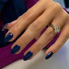 KXAMELIE front view of navy short oval press-on nails showing polished finish and variety