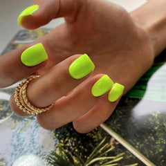 KXAMELIE front view of neon green press-on nails showing full packaging and bold color benefit